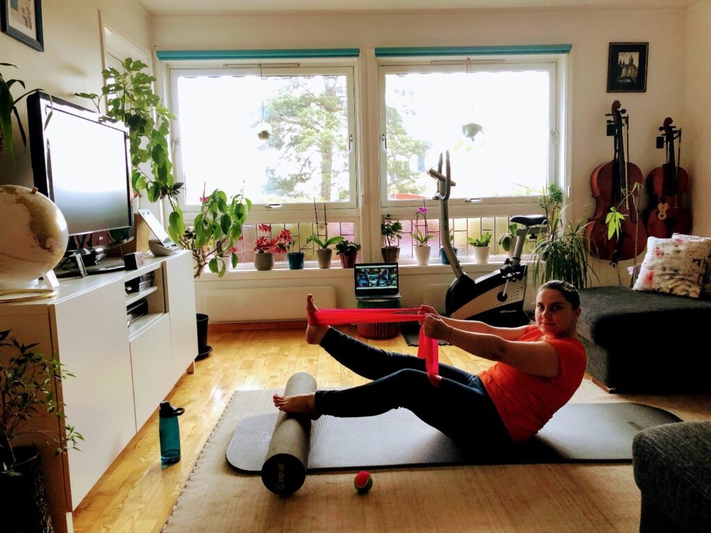 A woman working out in her living room.