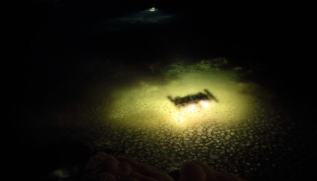 A photo of the ROV in dark waters.