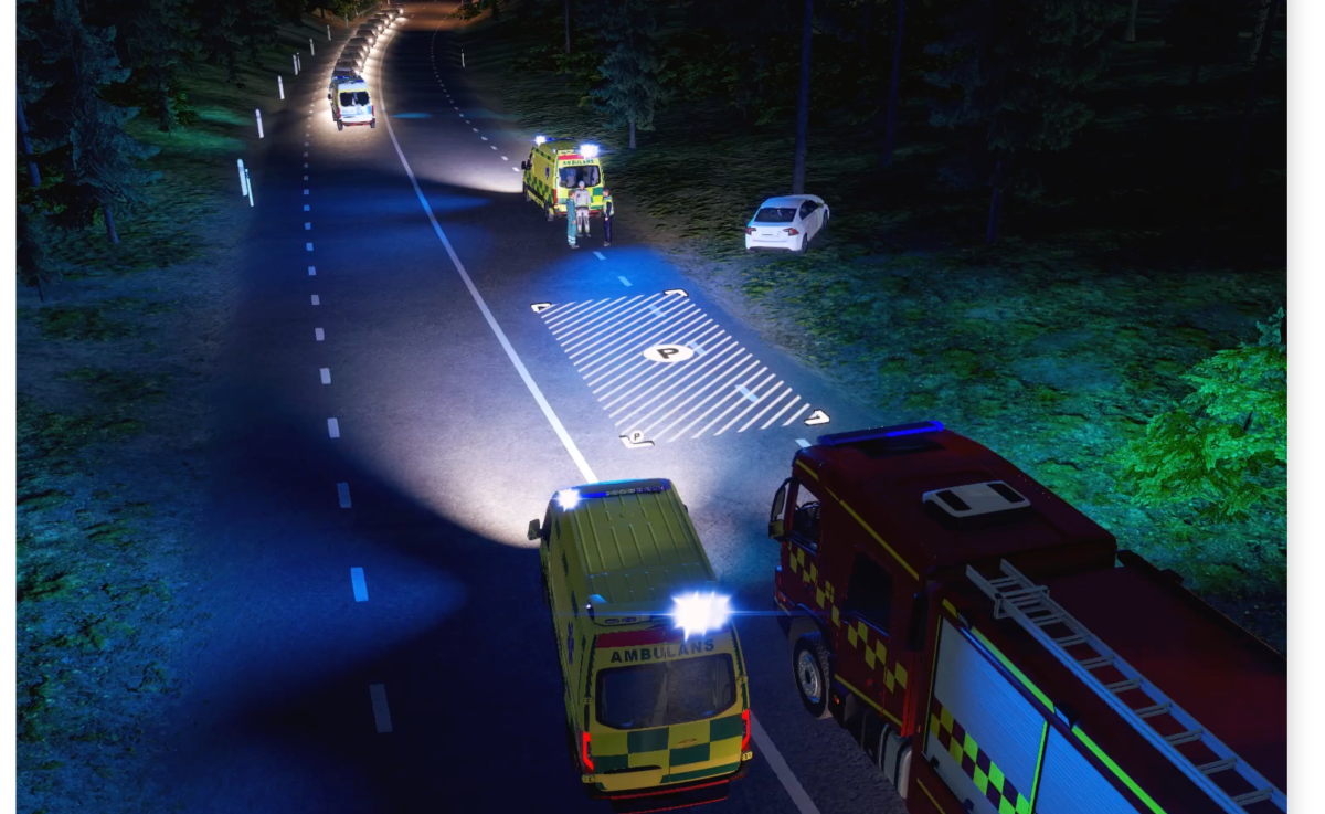 Illustrasjonsfoto fra VR-øving på skjerm, med ambulanse og brannbil på ulykkessted.